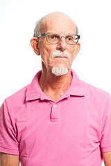 Obraz premium Serious well dressed senior man with glasses. Isolated.