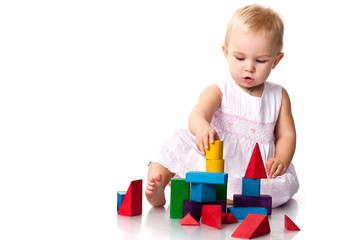 Beautiful baby building a castle
