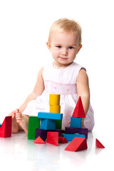 Beautiful baby building a castle