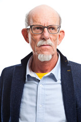 Obraz premium Serious well dressed senior man with glasses. Isolated.
