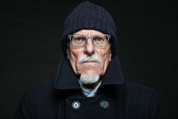 Good looking senior man winter fashion. Studio shot.