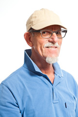 Sportive senior man with cap. Isolated on white.