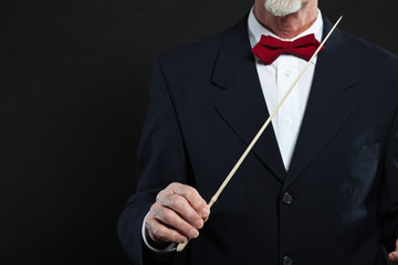 Conductor conducting an orchestra isolated. © ysbrandcosijn