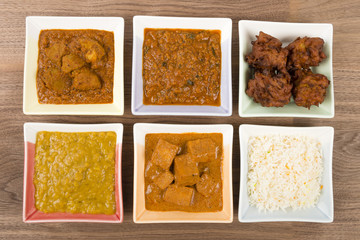 Thali - Indian vegetarian and meat curries, rice and bhajis