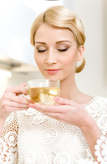 Portrait of beautiful girl drinking tea