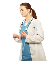 Young nurse standing with folded arms isolated