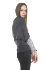 Portrait of young female in jeans looking sideways