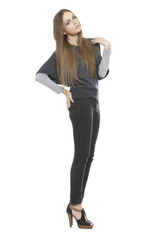 Full length of female in jeans looking sideways isolated
