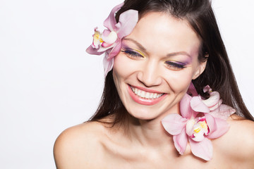 Girl with orchid flowers in hair