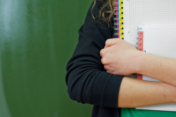 Student girl holding notebooks