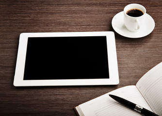 empty tablet and a coffee on the desk