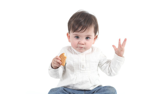 Baby eating a cookie