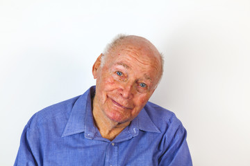 happy elderly man sitting in a chair