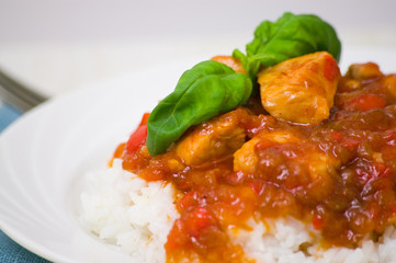 chicken breast with sauce and rice