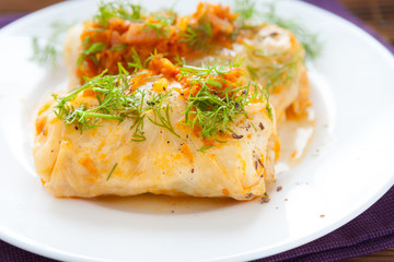 cabbage rolls closeup on white plate,