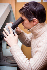 Fototapeta premium Scientist with microscope