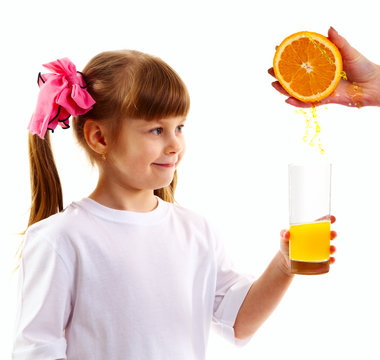 Orange juice fills a glass