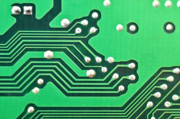 Close up of a printed green computer circuit board