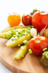 Pickled vegetables on a wooden board