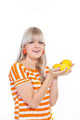 Beautiful girl holding fresh lemons