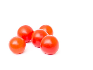 Cherry tomatoes isolated on white background