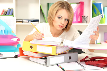 Tired business woman working in office