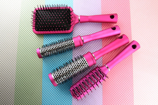 Comb brushes on bright background