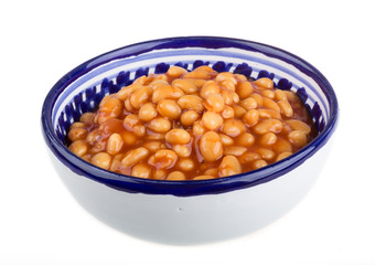 Marinated haricot beans in tomato sauce with shallots on a plate