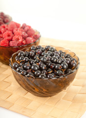 different fresh berries: raspberries, currant, dogwood berries