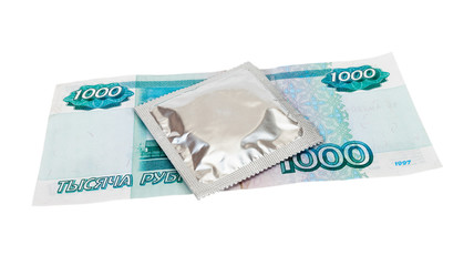 Condom with money on white