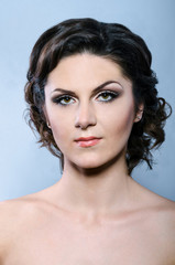 glamour woman with modern curly hairstyle and brightly makeup