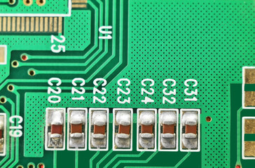 Close up of a printed green computer circuit board