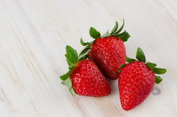 Three fresh strawberries