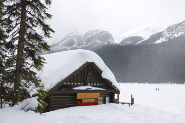 Cabin in the woods in the middle of winter