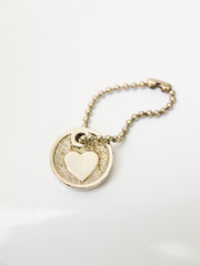 A miniature heart keychain isolated on white background