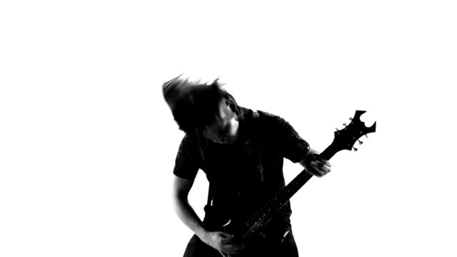 Playing heavy metal music on a guitar. Black and white video.