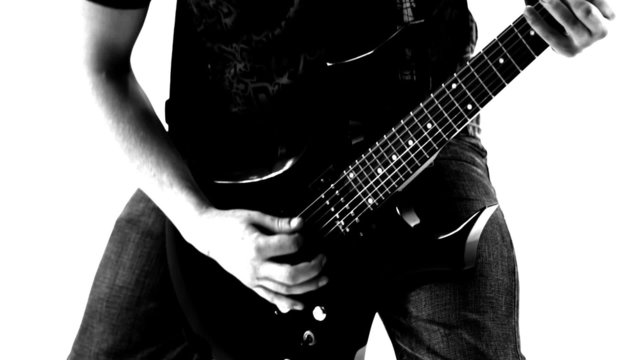 Playing guitar. Black and white.