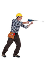 Man using drill with long bit
