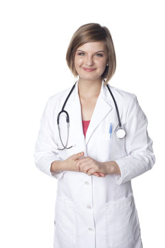 Smiling Caucasian doctor with hands clasped