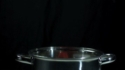 Jalapeno chili falling into a pot - Powered by Adobe
