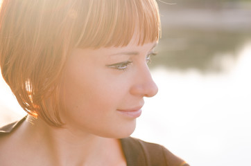 Red woman in warm sunshine