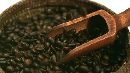 Coffee beans falling into basket in slow motion - Powered by Adobe