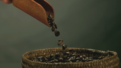 Hand pouring coffee beans into basket in slow motion - Powered by Adobe