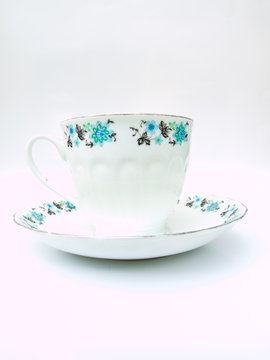 A  floral pattern tea cup isolated on white background