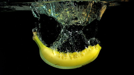Banana falling into water in slow motion - Powered by Adobe