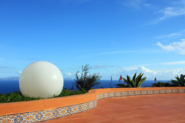 Big white ball and tropical scenery