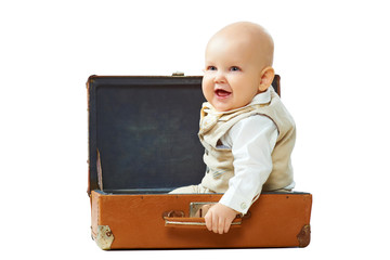 Cute baby in vintage suitcase