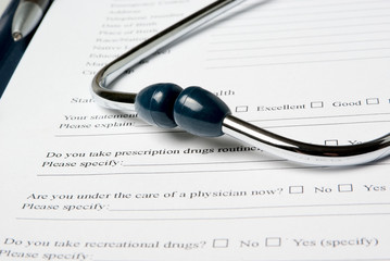 Stethoscope on medical document (medical questionnaire)