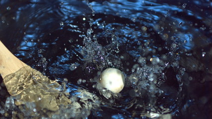 Wooden spoon with mushrooms in slow motion - Powered by Adobe