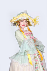 Woman wearing period ball gown costume